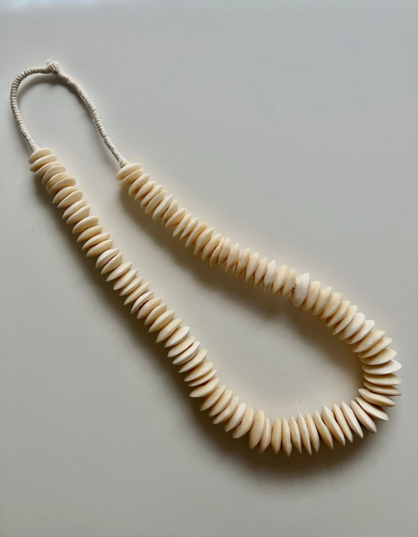 NATURAL SAUCER BONE BEAD